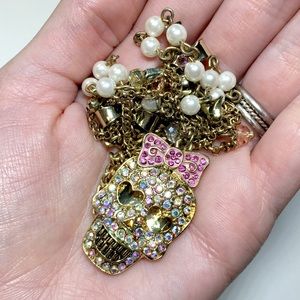 gold tone rainbow glitter gem skull charm necklace